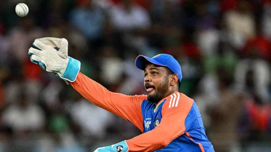 India's Sanju Samson receives a throw during the Asia Cup 2025 Super Four Twenty20 international cricket match between Bangladesh and India at the Dubai International Stadium in Dubai on September 24, 2025. (Photo by Sajjad HUSSAIN / AFP)