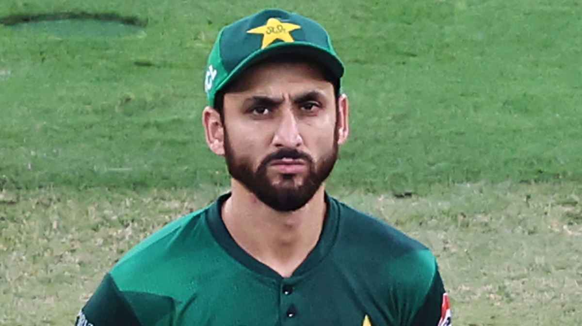 Pakistan's captain Salman Agha stands next to the trophy during the toss before the start of the Asia Cup 2025 Twenty20 international cricket final match between India and Pakistan at the Dubai International Stadium in Dubai on September 28, 2025. (Photo by Fadel SENNA / AFP)