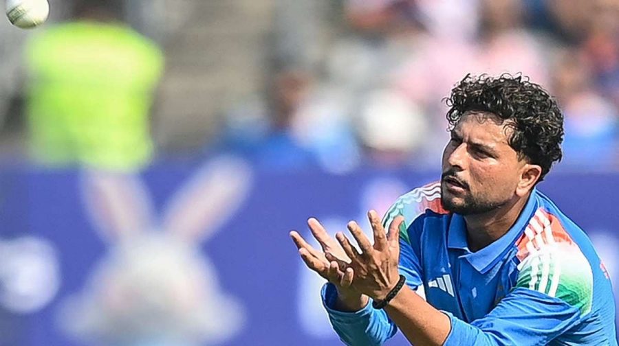 India's Kuldeep Yadav collects the ball during the first one-day international (ODI) cricket match between India and New Zealand at the Kotambi Stadium in Vadodara on January 11, 2026. (Photo by Shammi MEHRA / AFP) / -- IMAGE RESTRICTED TO EDITORIAL USE - STRICTLY NO COMMERCIAL USE --