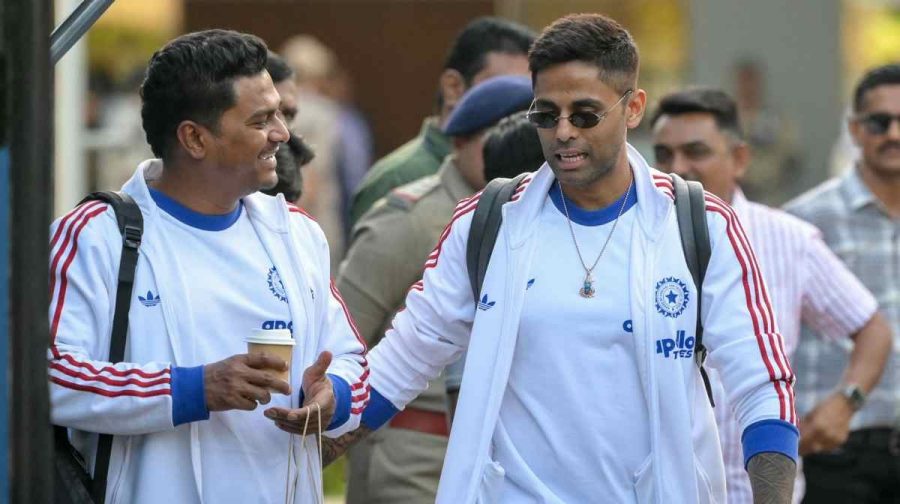 India's captain Suryakumar Yadav (R) arrives at Ahmedabad airport ahead of the 2026 ICC Men's T20 Cricket World Cup final match against New Zealand in Ahmedabad on March 6, 2026. (Photo by Shammi MEHRA / AFP)
