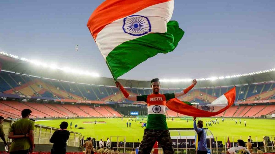 A man waves the national flag on the eve of ICC Men's T20 World Cup 2026 final cricket match between India and New Zealand, at the Narendra Modi Stadium, in Ahmedabad.