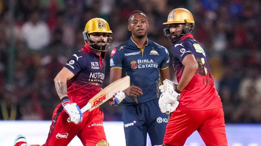 Bengaluru: Royal Challengers Bengaluru's Devdutt Paddikal, right, and Virat Kohli, left, run between the wickets during an Indian Premier League (IPL) 2026 T20 cricket match between Royal Challengers Bengaluru and Gujarat Titans, in Bengaluru, Karnataka, Friday, April 24, 2026. (PTI Photo/Shailendra Bhojak) (PTI04_24_2026_000613B)