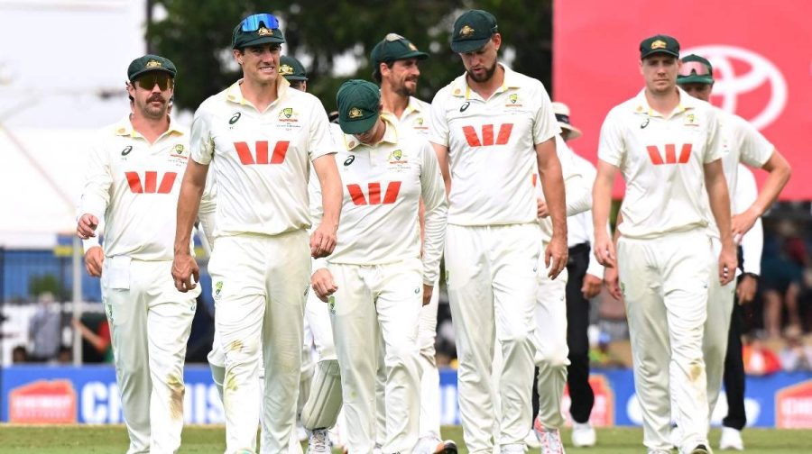 Australian captain Pat Cummins, second left, leads his players from the field following their nine wicket loss to Bangladesh on day four of the first cricket test in Darwin, Australia, Sunday, Aug. 16, 2026. (AP/PTI)(AP08_16_2026_000084A)