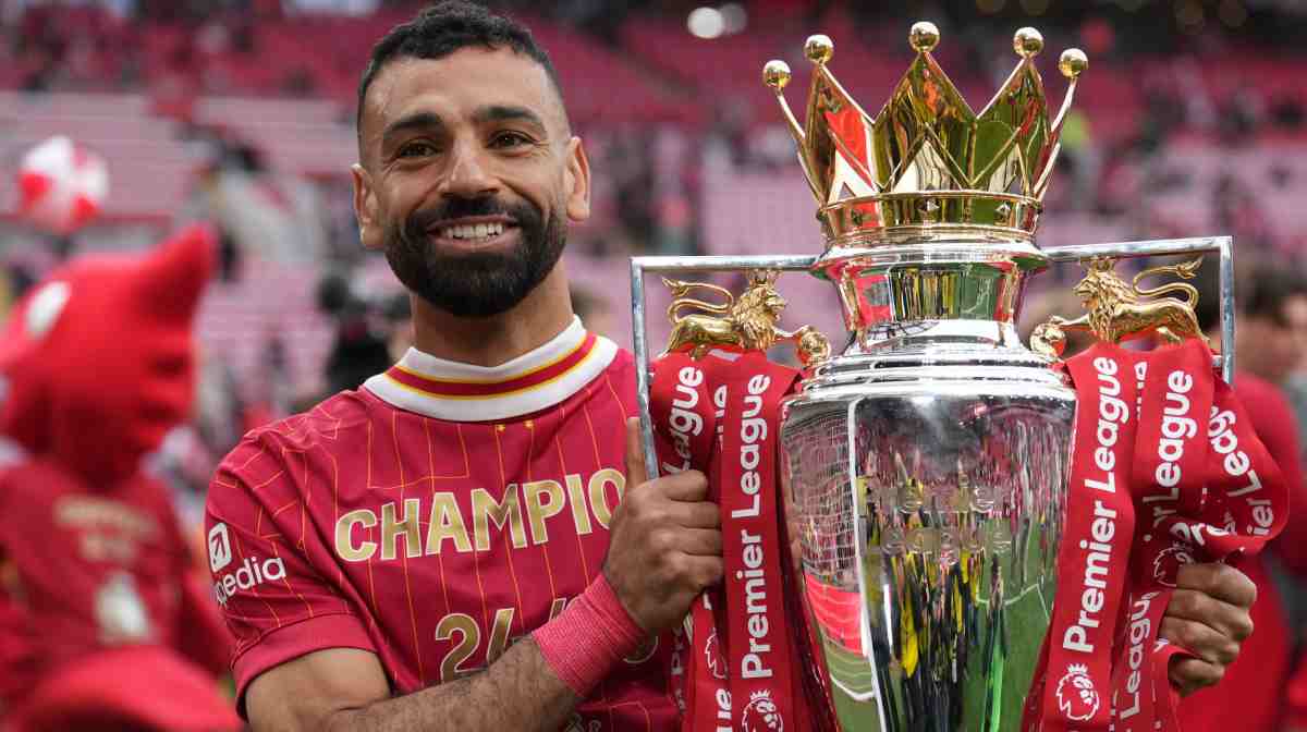 FILE - Liverpool's Mohamed Salah poses with the winner's trophy after the English Premier League soccer match between Liverpool and Crystal Palace at the Anfield stadium in Liverpool, England, May 25, 2025. (AP Photo/Jon Super, File)
