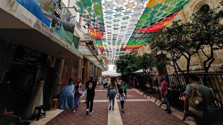 People walk under a canopy of embroidered decorations in downtown Guadalajara ahead of the 2026 FIFA World Cup, in Guadalajara, Mexico, June 10, 2026. REUTERS/Victor Medina
