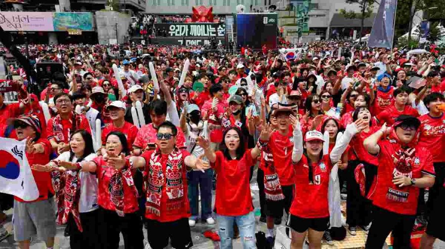 Fans cheer as they watch South Korea play the Czech Republic during their FIFA World Cup 2026 Group A match, at a public viewing event in Seoul, South Korea, June 12, 2026. REUTERS/Kim Soo-hyeon