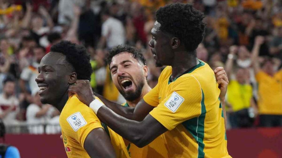 Australia's Nestory Irankunda (17), Australia's Mohamed Toure (9) and Australia's Jacob Italiano (4) celebrate a goal against Turkey during a World Cup Group D soccer match, in Vancouver, Canada, Saturday, June 13, 2026. (Darryl Dyck/The Canadian Press via AP)