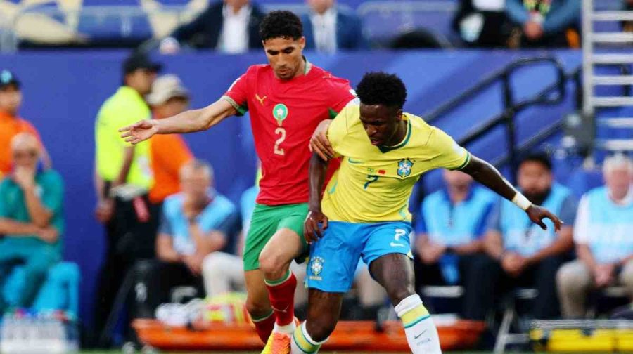 Soccer Football - FIFA World Cup 2026 - Group C - Brazil v Morocco - New York/New Jersey Stadium, East Rutherford, New Jersey, U.S. - June 13, 2026
Brazil's Vinicius Junior in action with Morocco's Achraf Hakimi IMAGN IMAGES via Reuters/Caean Couto