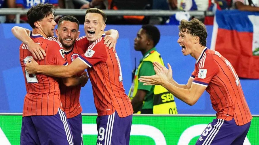 Scotland's John McGinn (7) celebrates with teammate's Aaron Hickey (2), Lewis Ferguson (19) and Jack Hendry (13) after scoring his teams first goal during the World Cup Group C soccer match between Haiti and Scotland in Foxborough, Mass., near Boston, Saturday, June 13, 2026. (AP Photo/Martin Meissner)