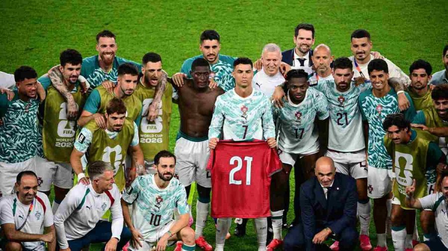 Portugal's Cristiano Ronaldo (7), joined by teammates, holds the jersey of the late Diogo Jota, who died last year, after the World Cup round of 32 soccer match between Portugal and Croatia in Toronto, Thursday, July 2, 2026. (Sammy Kogan/The Canadian Press via AP)