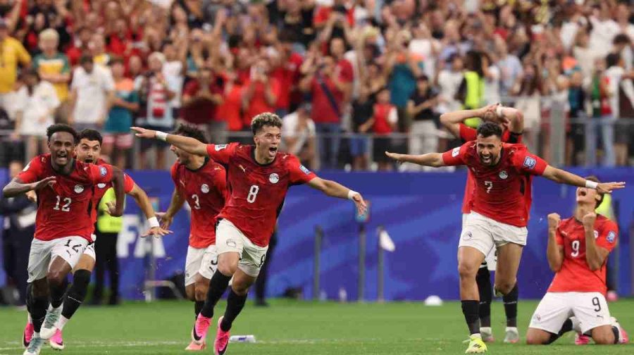Egypts players celebrate after their teammate Hossam Abdelmaguid (4) score the winning penalty during World Cup round of 32 soccer match between Australia and Egypt in Arlington, Texas, near Dallas, Tuesday, Friday, July 3, 2026. (AP Photo/Sam Hodde)