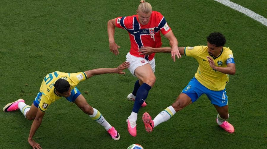 Norway's Erling Haaland (9) battles for the ball with Brazil's Douglas Santos (16) and Marquinhos (4) during the World Cup round of 16 soccer match between Brazil and Norway in East Rutherford, N.J., near New York, Sunday, July 5, 2026. (AP/PTI)
