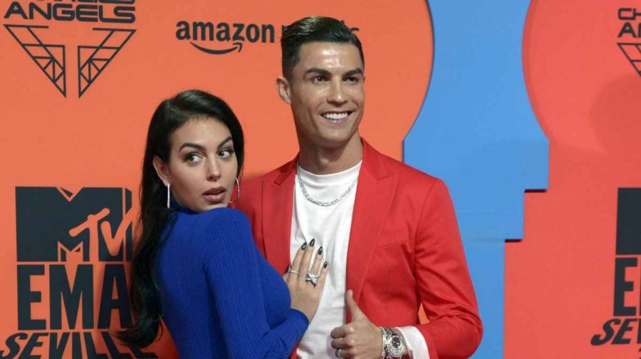 (FILES) Juventus' Portuguese forward Cristiano Ronaldo (R) and his partner Georgina Rodriguez (L) pose on the red carpet upon their arrival to the MTV Europe Music Awards at the FIBES Conference and Exhibition Centre of Seville on November 3, 2019. Cristiano Ronaldo and his long-time partner Georgina Rodriguez married on August 11, 2026, according to the Portuguese football superstar's representatives. Ronaldo, 41, shared a photo of the couple's hands with their wedding bands and the caption: "C (heart) G" on his Instagram account. The ceremony took place in the Portuguese coastal resort of Cascais, near Lisbon, the Brunswick Group managing the player's public relations told AFP. (Photo by CRISTINA QUICLER / AFP)