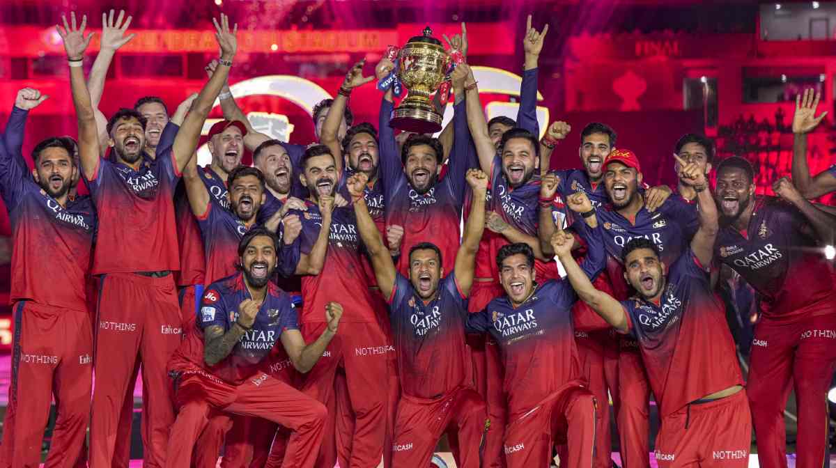 Ahmedabad: Royal Challengers Bengaluru s captain Rajat Patidar lifts the championship trophy as players celebrate during the presentation ceremony of the Indian Premier League (IPL) 2025 final, at the Narendra Modi Stadium, in Ahmedabad, Tuesday, June 3, 2025. (PTI Photo/Arun Sharma) (PTI06_04_2025_000093A)
