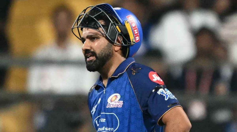 Mumbai Indians' Indian cricket player Rohit Sharma reacts as he suffers an injury during the 2026 Indian Premier League (IPL) T20 match between Mumbai Indians and Royal Challengers Bengaluru at the Wankhede Stadium in Mumbai on April 12, 2026. (Photo by Indranil MUKHERJEE / AFP) / -- IMAGE RESTRICTED TO EDITORIAL USE - STRICTLY NO COMMERCIAL USE --