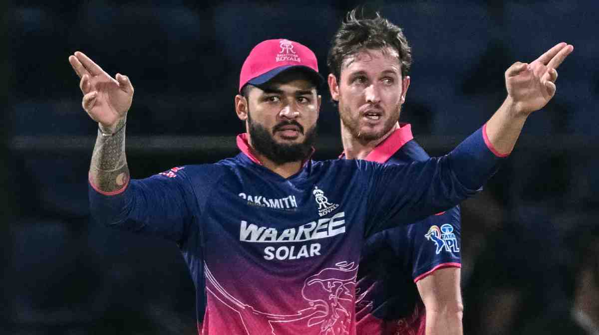 Rajasthan Royals' captain Indian cricket player Riyan Parag (L) adjusts the field as teammate New Zealand cricket player Adam Milne looks on during the 2026 Indian Premier League (IPL) T20 match between Delhi Capitals and Rajasthan Royals at the Arun Jaitley Stadium in New Delhi on May 17, 2026. (Photo by Arun SANKAR / AFP) / -- IMAGE RESTRICTED TO EDITORIAL USE - STRICTLY NO COMMERCIAL USE --