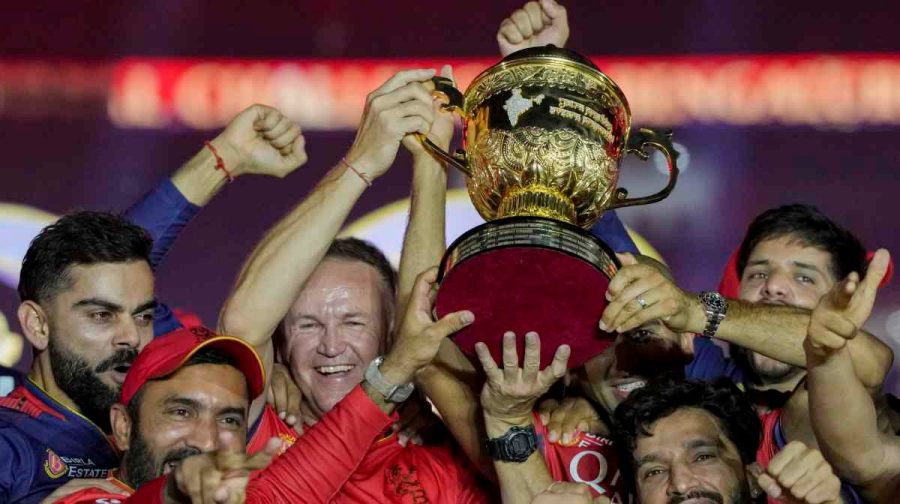 Ahmedabad: Royal Challengers Bengaluru s Head Coach Andy Flower, captain Rajat Patidar and others lift the championship trophy during the presentation ceremony of the Indian Premier League (IPL) 2025 final, at the Narendra Modi Stadium, in Ahmedabad, Tuesday, June 3, 2025. (PTI Photo/Atul Yadav) (PTI06_04_2025_000075B)