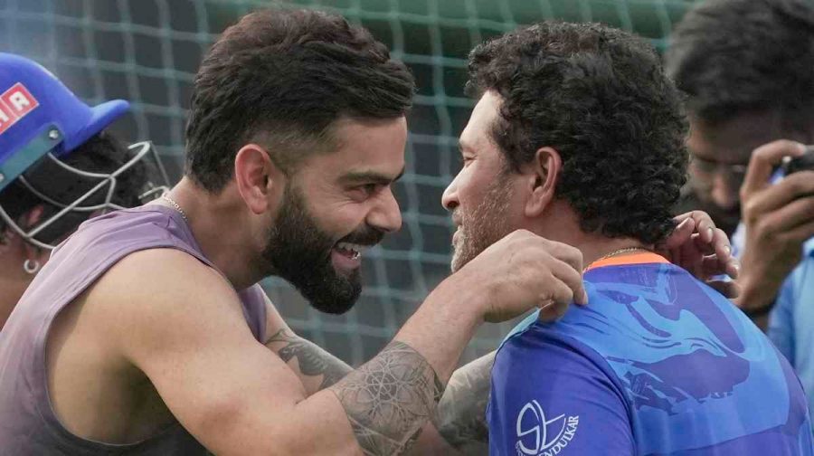 Mumbai: Royal Challengers Bangalore player Virat Kohli with Mumbai Indians mentor Sachin Tendulkar during a practice session ahead of the IPL 2023 cricket match between Mumbai Indians and Royal Challengers Bangalore, at Wankhede Stadium in Mumbai, Monday, May 8, 2023. (PTI Photo/Kunal Patil)(PTI05_08_2023_000286A)