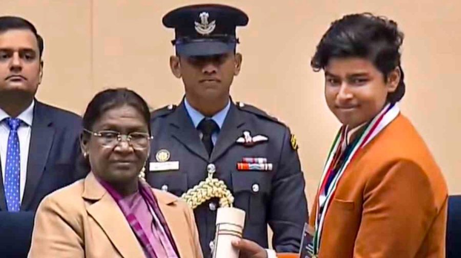 **EDS: THIRD PARTY IMAGE** In this screenshot from a video posted on Dec. 26, 2025, President Droupadi Murmu confers the 'Pradhan Mantri Rashtriya Bal Puraskar' on cricketer Vaibhav Suryavanshi during a ceremony on the occasion of 'Veer Bal Diwas', in New Delhi. (@PresidentOfIndia/YT via PTI Photo) (PTI12_26_2025_000152B)