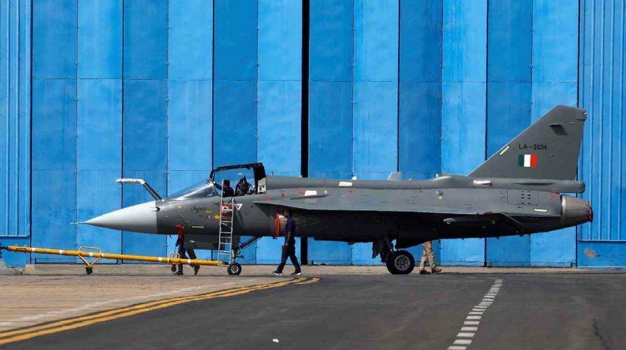 Tejas light combat aircraft is towed by ground crew members at the HAL Airport in Bengaluru, India,