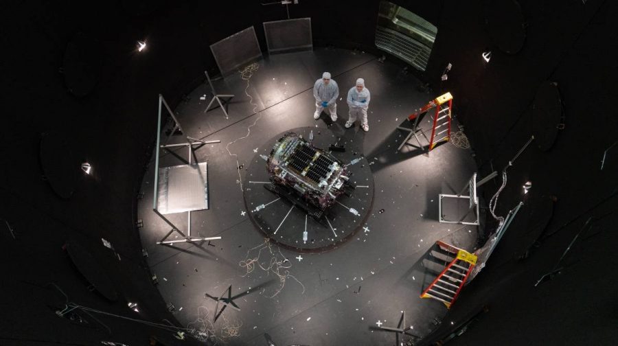 Kieran Wilson, LINKs principal investigator, and Hunter Robertson,space systems engineer, standing next to spacecraft inside the SES (Space Environment Simulator) at NASAs Goddard Space Flight Center (Sophia Roberts/NASA via AP)