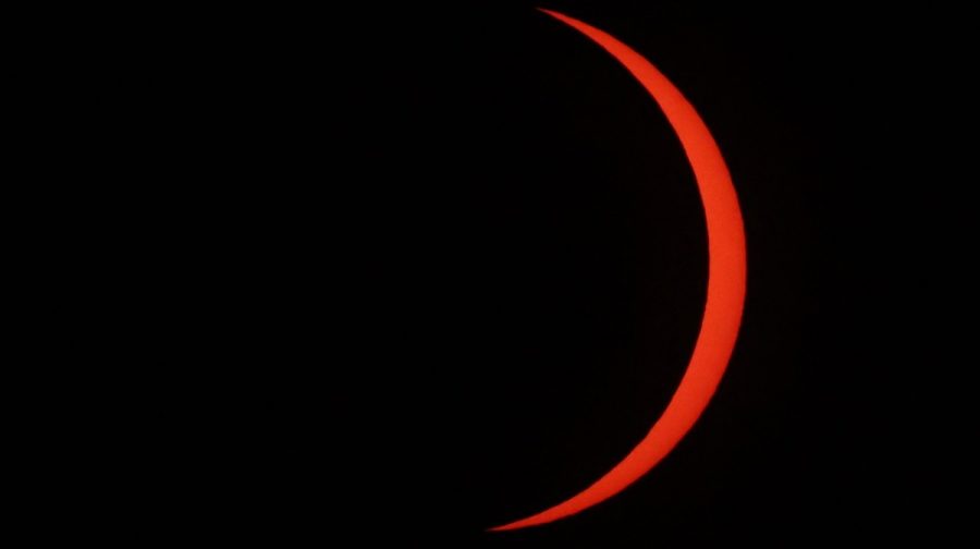 The Moon uncovers the Sun in the moments following totality of the solar eclipse as seen from La Zurriola beach in San Sebastian, on August 12, 2026. Millions of Europeans contemplated the sky in awe today during a rare total solar eclipse that will plunge a swathe of Spain into an eerie daytime darkness. The shadow cast when the Moon covers the Sun began in Russia's remote Arctic north at around 1700 GMT and continued in an arc through Greenland and Iceland. Spain is where most people viewed the total eclipse, which crossed the country diagonally from the northern Atlantic coast to the Mediterranean Sea, where it vanished at around 1830 GMT. (Photo by Thomas COEX / AFP)