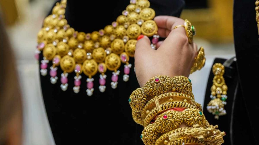 **EDS: FILE PHOTO** New Delhi: In this Tuesday, Oct. 29, 2024 file image, Gold ornaments on display at a jewellery showroom, in New Delhi. Gold prices inched closer to the psychological mark of Rs 1 lakh per 10 grams as the bullion rates surged Rs 1,650 in the national capital on Monday, April 21, 2025, on weak dollar and uncertainties over US-China trade war driving demand. (PTI Photo/Arun Sharma) (PTI04_21_2025_000240B)