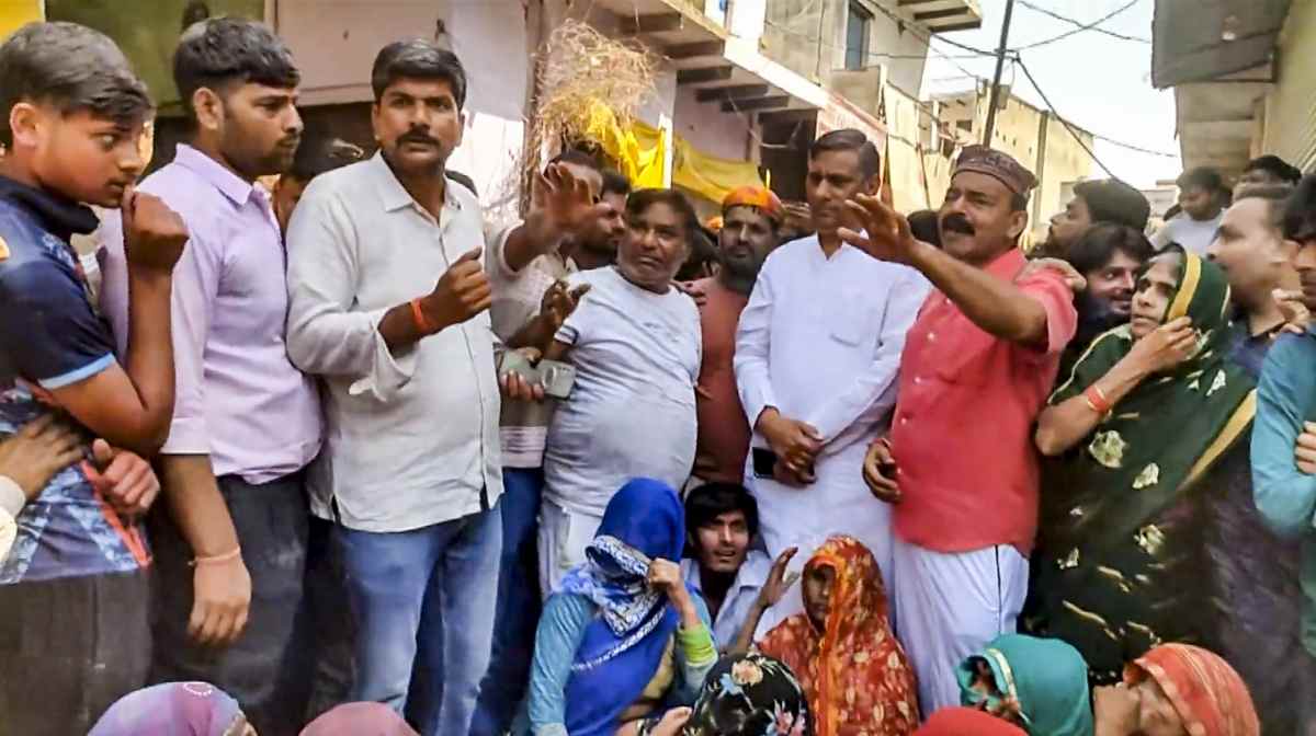 Relatives protest over the alleged rape of a seven-year-old girl at a village, in Hathras district, Monday, March 17, 2025. PTI Photo