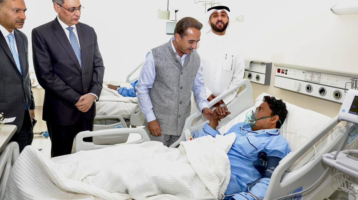 **EDS: IMAGE VIA @indembkwt** Kuwait: MoS for External Affairs Kirti Vardhan Singh meets Indians injured in a fire incident at the Jaber hospital, in Kuwait, Thursday, June 13, 2024. A fire engulfed a multi-storey building in Kuwait on Wednesday, killing 49 foreign workers, including around 40 Indians, and injured 50 others, according to officials. (PTI Photo)(PTI06_13_2024_000135A) *** Local Caption *** 
