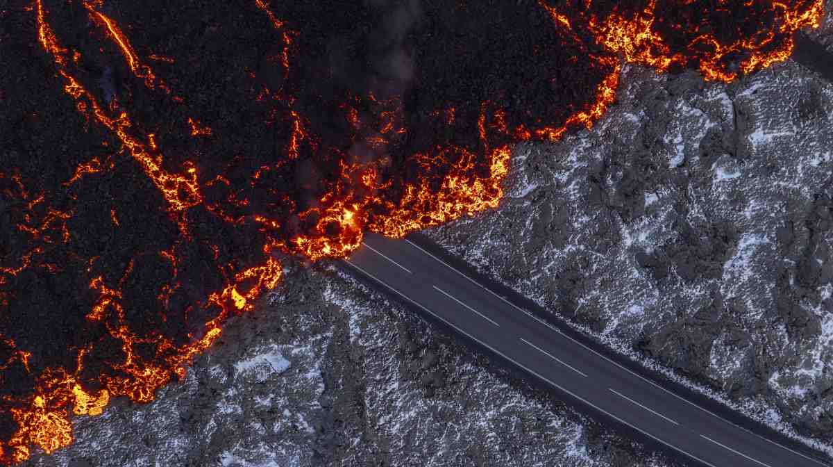 Molten lava flows on the road to the Blue Lagoon, Grindavik, after the volcanic eruption that started Wednesday, on the Reykjanes Peninsula in Iceland