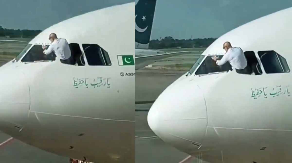 pilot-cleans-window-of-aircraft