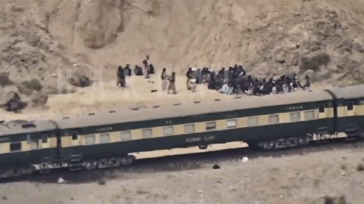 In this frame grab from a video released by the Baluchistan Liberation Army shows people outside the a train after being attacked by the BLA on its transit from Quetta to the northern city of Peshawar, in Bolan district, Pakistan's southwestern Balochistan province, March 12, 2025.AP/PTI

