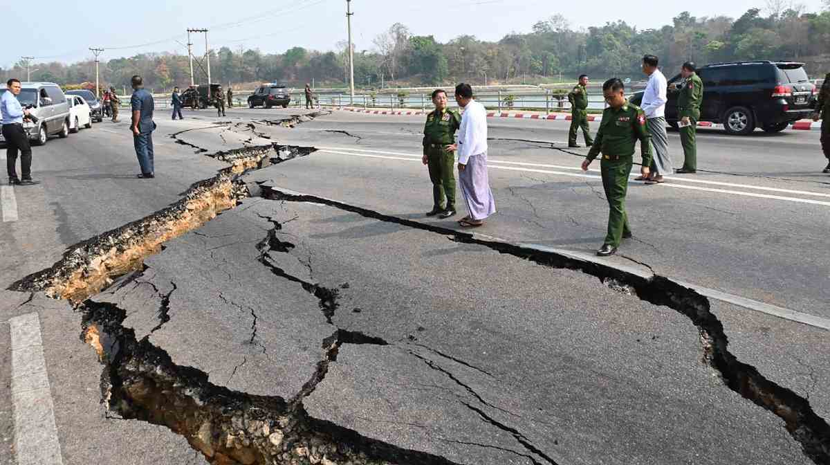 In this image provided by The Myanmar Military True News Information Team, Myanmar's military leader Senior Gen. Min Aung Hlaing, center, inspects damaged road caused by an earthquake Friday, March 28, 2025, in Naypyitaw, Myanmar. (The Myanmar Military True News Information Team via AP)AP/PTI(AP03_28_2025_000504A)