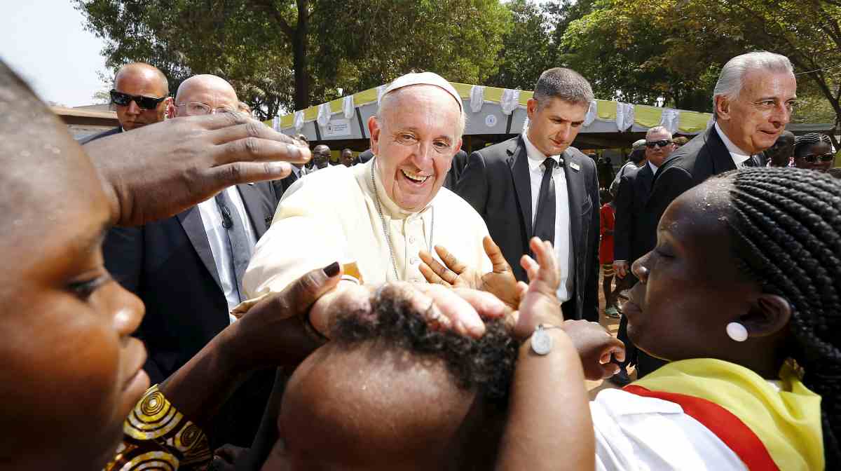 FILE PHOTO: Pope Francis blesses a child as he visits the refugee camp of Saint Sauveur in Bangui, Central African Republic, November 29, 2015. REUTERS/Stefano Rellandini/File Photo