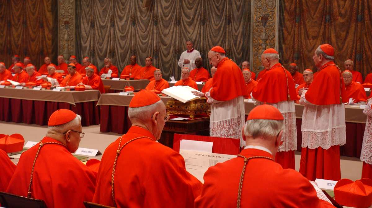 In this photo released by the Vatican paper L'Osservatore Romano, Italian Cardinal Giacomo Biffi takes an oath at the beginning of the conclave to elect the next pope in the Sistine Chapel at the Vatican, Monday, April 18, 2005. Starting Monday, 115 Cardinals from all around the world were sequestered inside the Sistine Chapel to elect the new head of the Roman Catholic Church.  (AP Photo/Osservatore Romano, ho)