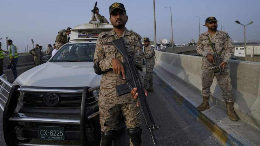 A paramilitary soldier stand alert on a road near Karachi port following raising military tension between Pakistan and India, in Karachi, Pakistan, Friday, May 9, 2025. (AP Photo/Fareed Khan)