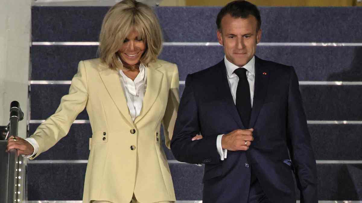 France's President Emmanuel Macron and his wife Brigitte Macron disembark from their plane upon their arrival at Halim Perdanakusuma International Airport in Jakarta on May 27, 2025. (Photo by YASUYOSHI CHIBA / AFP)