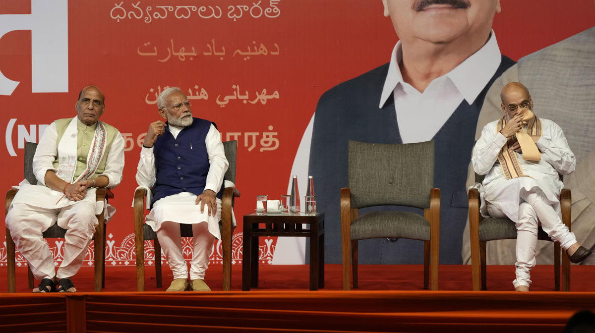 Prime Minister Narendra Modi shares the stage with Defense Minister Rajnath Singh, left, and Home Minister Amit Shah, right, before addressing supporters at the Bharatiya Janata Party (BJP) headquarters in New Delhi, India, Tuesday, June 4, 2024. (AP Photo/Manish Swarup)