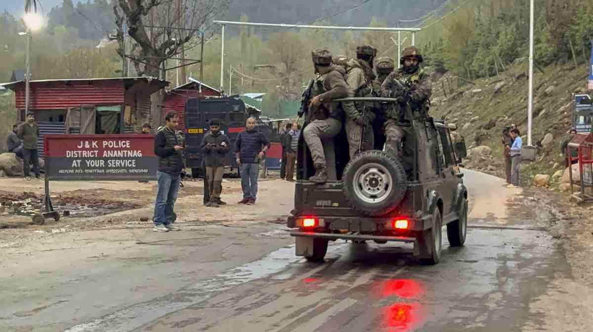 Security personnel move towards the site after terrorists attacked a group of tourists at Pahalgam, in Anantnag district, Jammu & Kashmir
