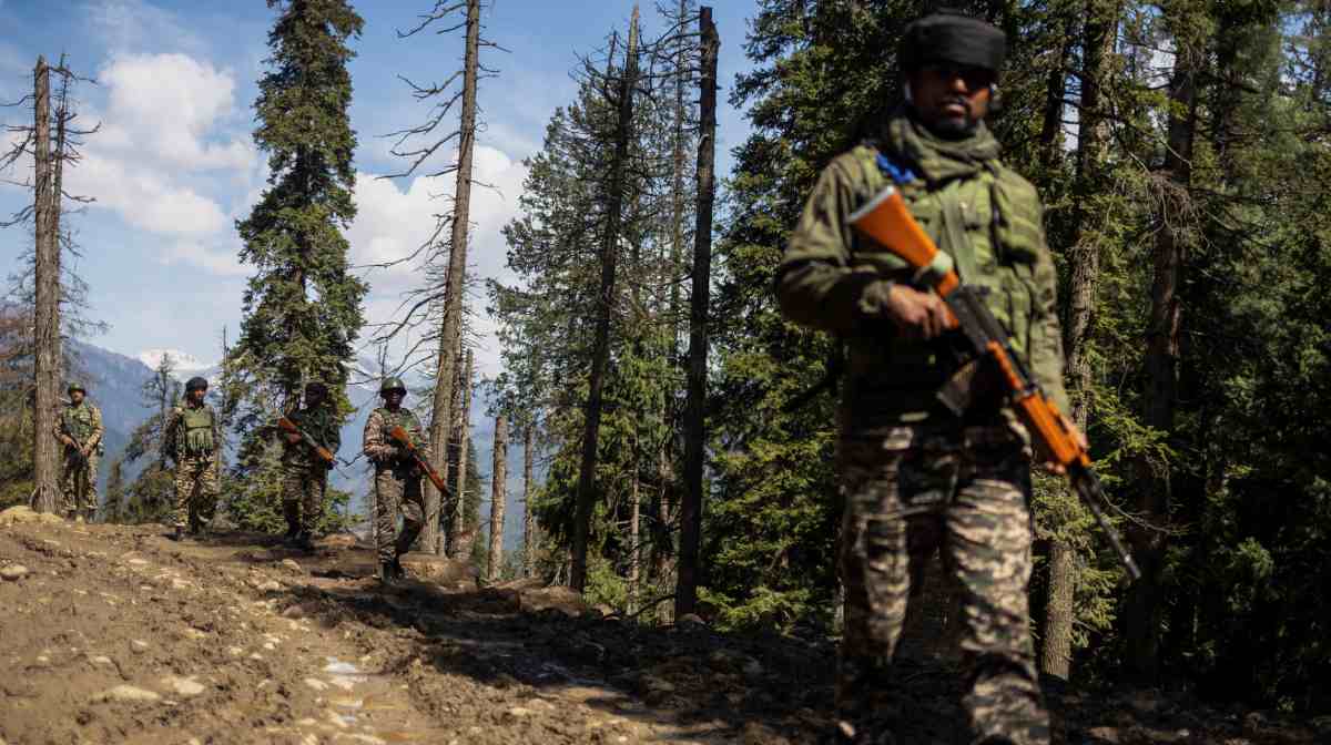 Indian security force personnel patrol at the site of a suspected militant attack on tourists in Baisaran near Pahalgam in south Kashmir's Anantnag district, April 24, 2025. REUTERS/Adnan Abidi