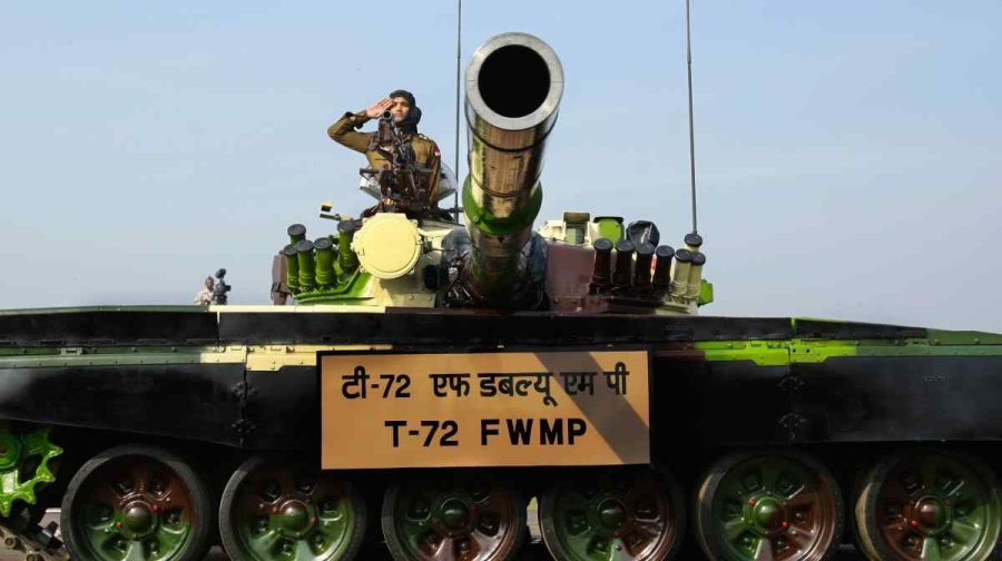 An Indian Army soldier atop a T-72 tank salutes during Army Day parade in New Delhi, India, Thursday, Jan. 15, 2009. (AP Photo/Gurinder Osan)