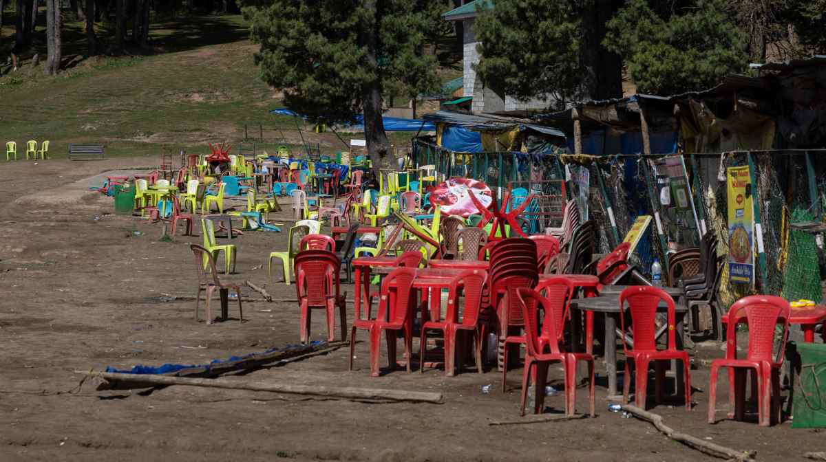 Chairs and tables are scattered at the site of a suspected militant attack on tourists in Baisaran near Pahalgam in south Kashmir's Anantnag district, April 24, 2025. REUTERS/Adnan Abidi
