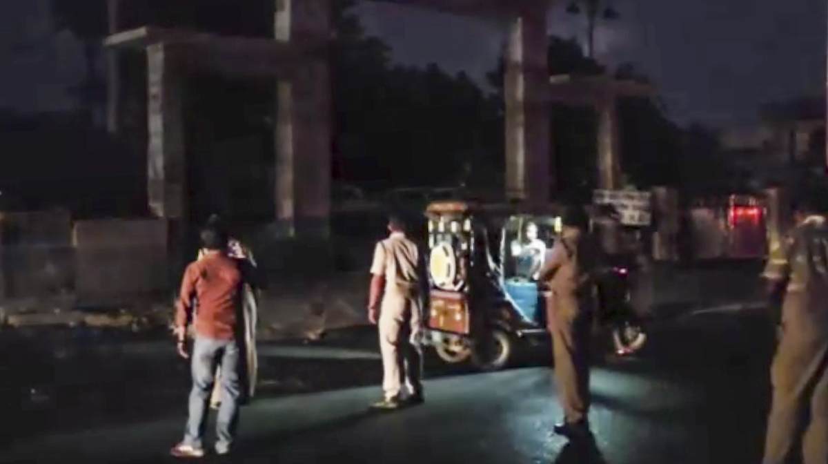 Security personnel on a road during blackout amid escalating tensions between India and Pakistan, in Barmer, Rajasthan.