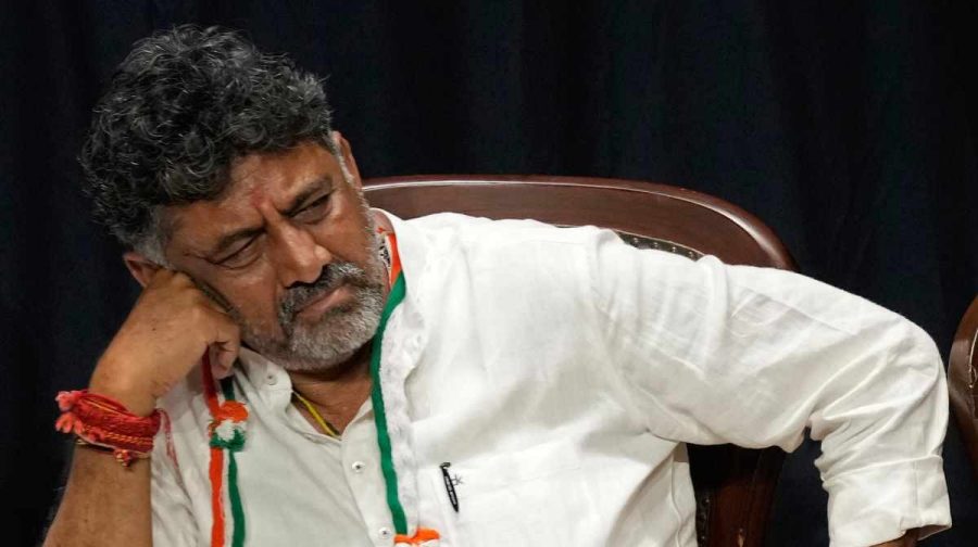 Congress party Karnataka state chief D. K. Shivakumar listens to his party president Mallikarjun Kharge during a press conference after their win in Karnataka state elections in Bengaluru, India, Saturday, May 13, 2023. Elections in India's southern state of Karnataka were held on May 10. (AP Photo/Aijaz Rahi)