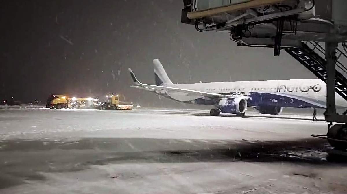 Border Road Organization (BRO) conducts snow clearance operations at the Srinagar Airport, in Srinagar on Saturday. 