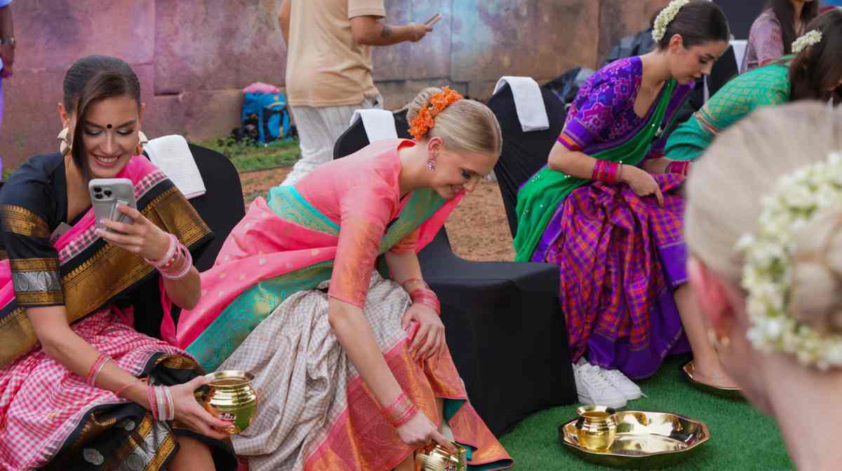 **EDS: THIRD PARTY IMAGE** In this image via Telangana DIPR, Miss World 2025 contestants wash their feet with water before entering the Ramappa temple, a UNESCO World Heritage Site, in Mulugu district, Telangana, Wednesday, May 14, 2025. (Telangana DIPR via PTI Photo)(PTI05_14_2025_000377B)