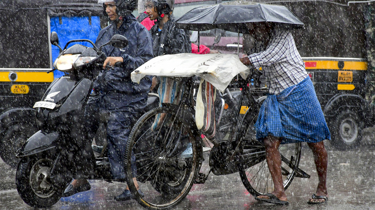 commuters-move-on-a-road-due-to-rain