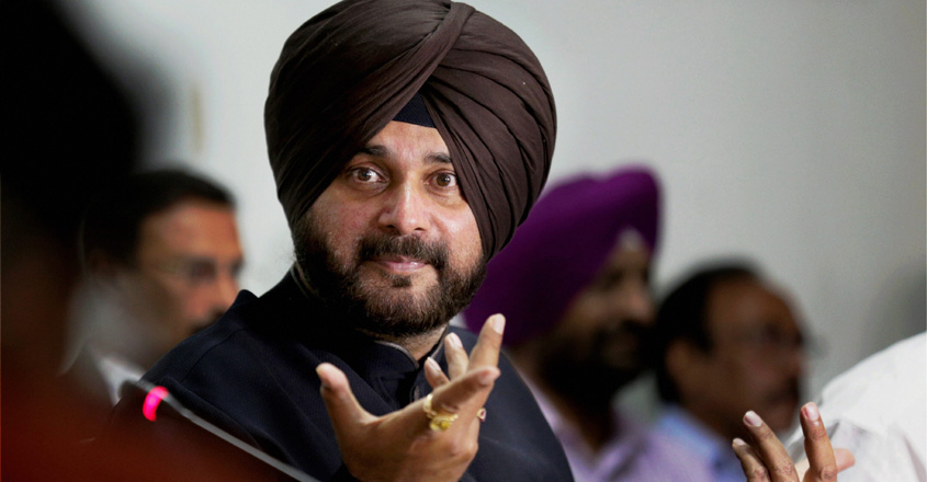 Amritsar: Punjab Minister for Tourism & Cultural Affairs Navjot Singh Sidhu gestures while addressing a press conference in Amritsar on Wednesday. PTI Photo (PTI5_2_2018_000065A)