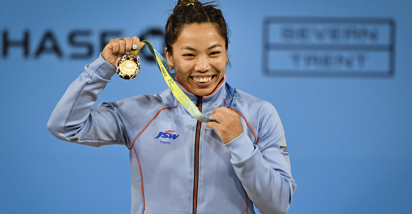 PTI07_30_2022_000338A Birmingham: India's Mirabai Chanu with the gold medal after winning women's 49kg weightlifting category match of the Commonwealth Games 2022 (CWG), in Birmingham, UK, Saturday, July 30, 2022. (PTI Photo/Swapan Mahapatra)(PTI07_30_2022_000338A)