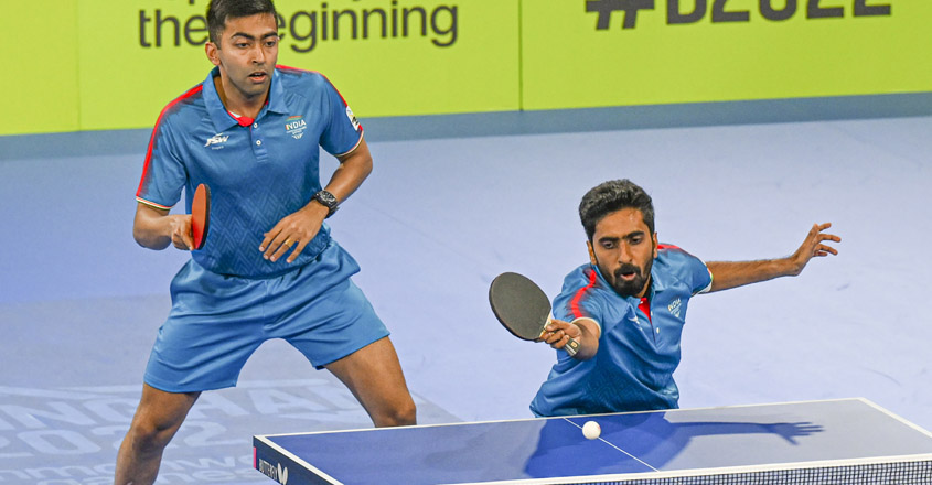 PTI08_02_2022_000231B Birmingham: India s Harmeet Desai and Sathiyan Gnanasekaran play against Singapore s Izaac Quek Yong and Pang Yew En Koen during the final of the Table Tennis Men s team event at the Commonwealth Games 2022 (CWG), in Birmingham, UK, Tuesday, Aug. 2, 2022. (PTI Photo/Swapan Mahapatra) (PTI08_02_2022_000231B)